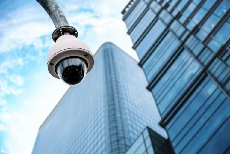 Outdoor dome security camera overlooking a building