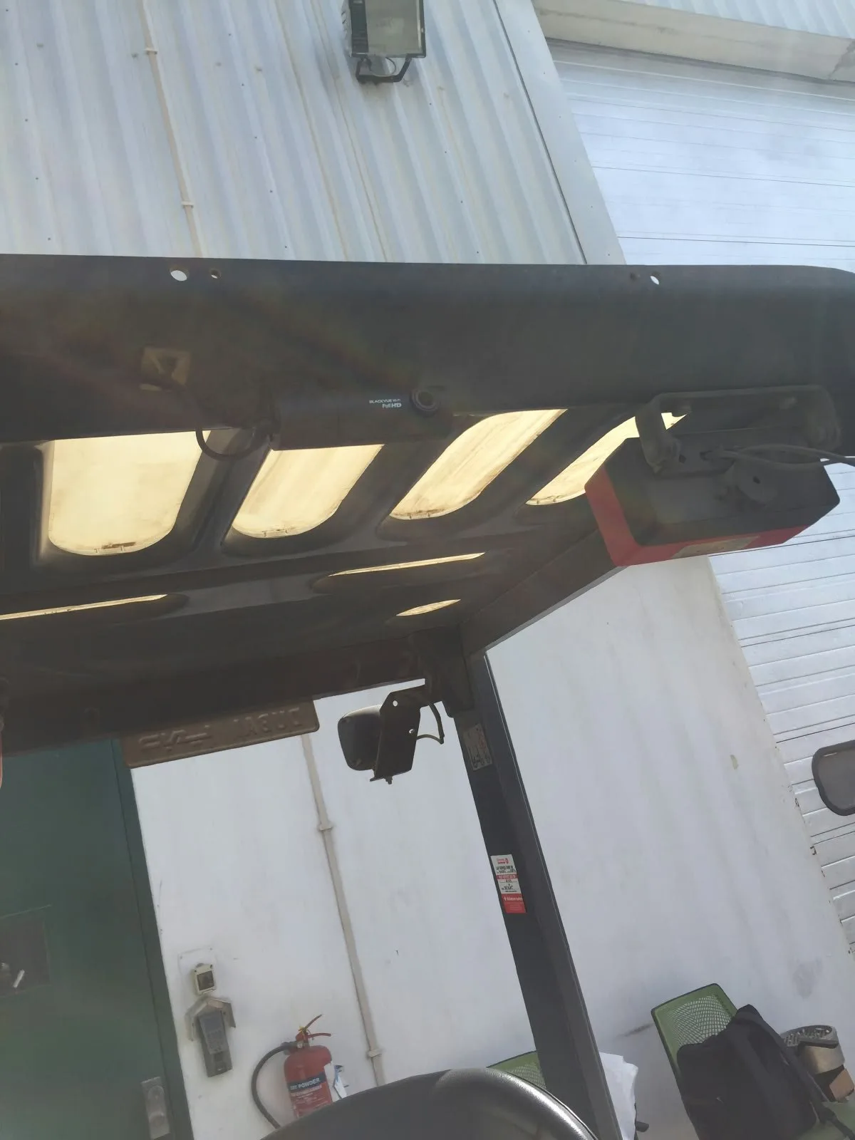 Driver-facing camera beneath the forklift overhead guard