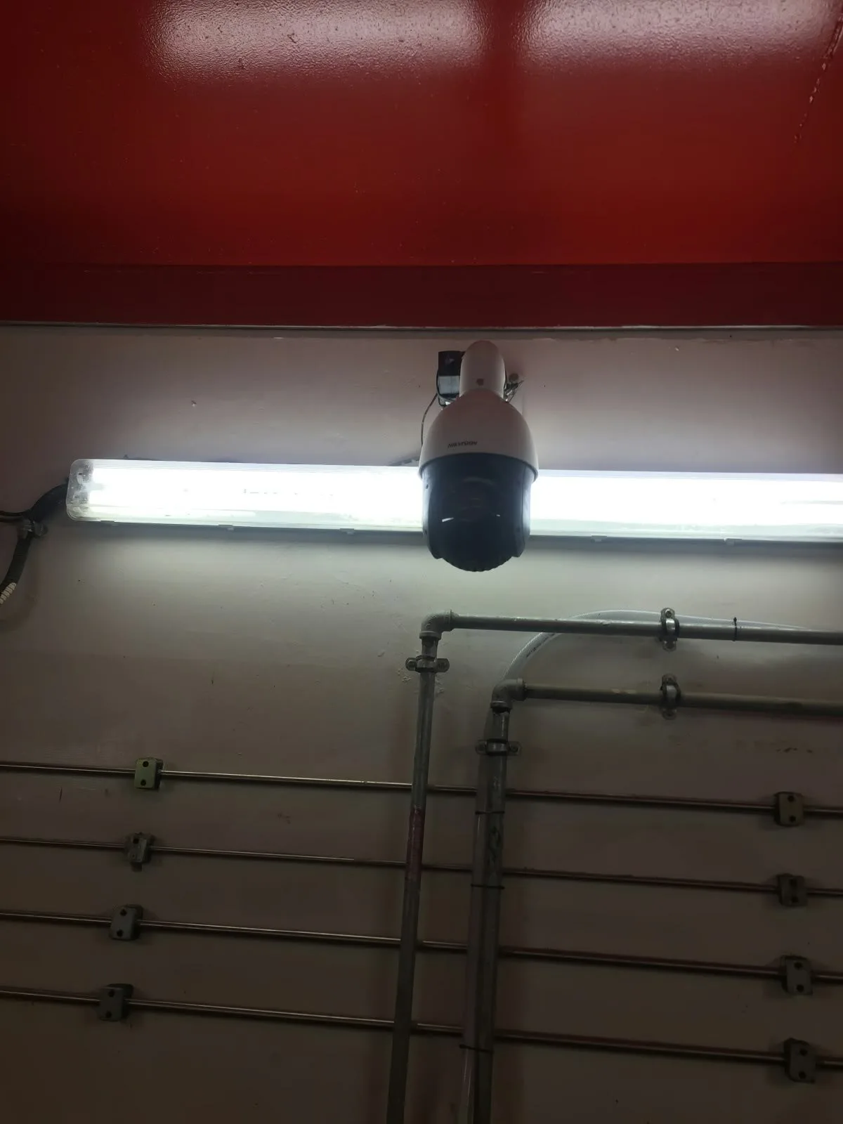 Camera mounted beneath the pressure testing bay overhead structure